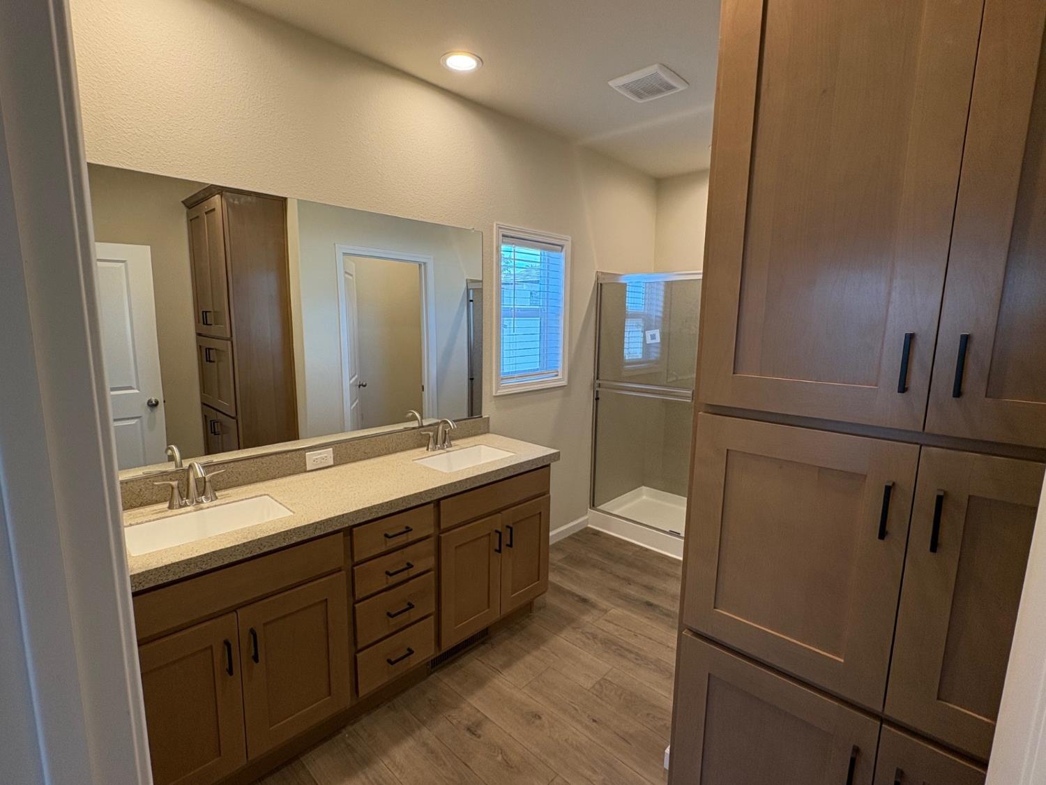 Undisclosed Address Medford, OR 97501 - Photo 6 of 9 a bathroom with a double vanity sink and a mirror