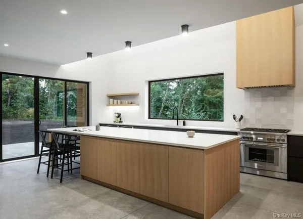 a kitchen with a sink and large window