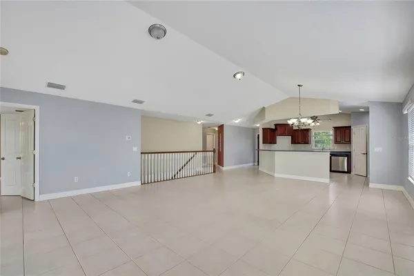 a large kitchen with stainless steel appliances granite countertop a stove and a sink