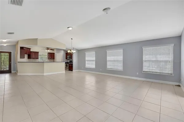 a view of a kitchen with a sink and a window