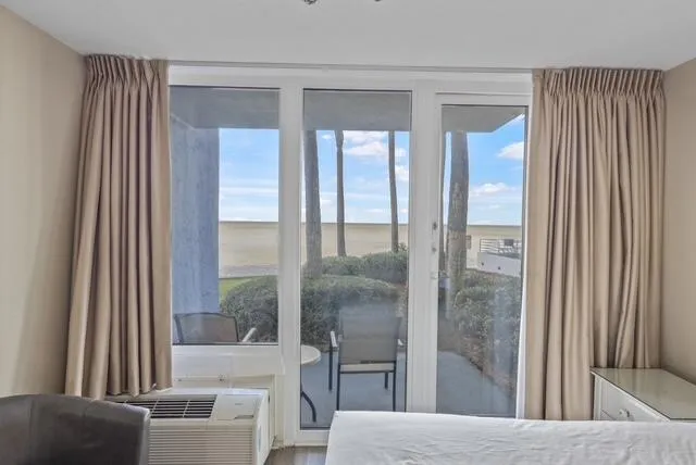 a view of a living room and a balcony