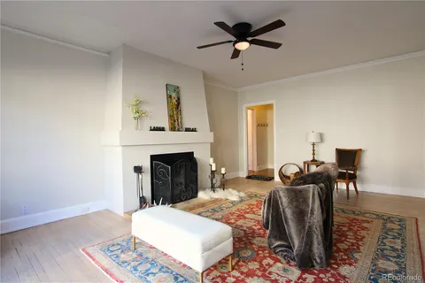 a view of a livingroom with furniture and a fireplace