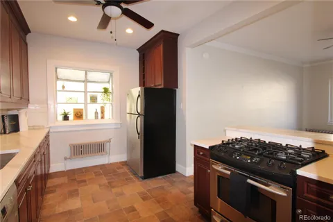 a kitchen with a stove and a refrigerator
