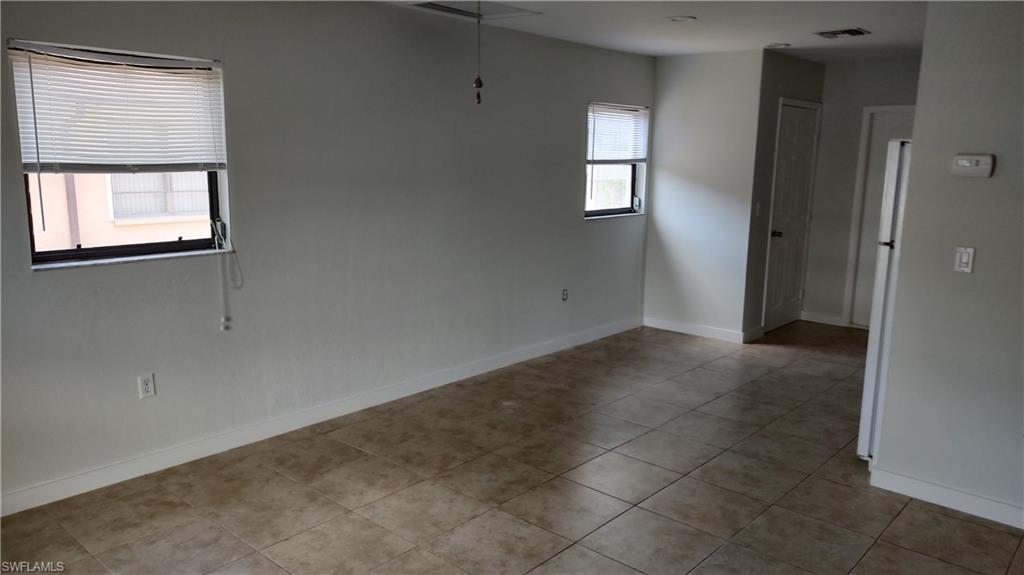 585 106th Avenue North Naples, FL 34108 - Photo 14 of 15 an empty room with windows and closet