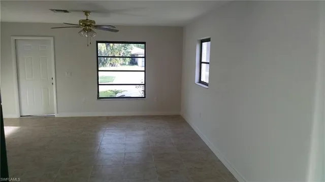 an empty room that has a window