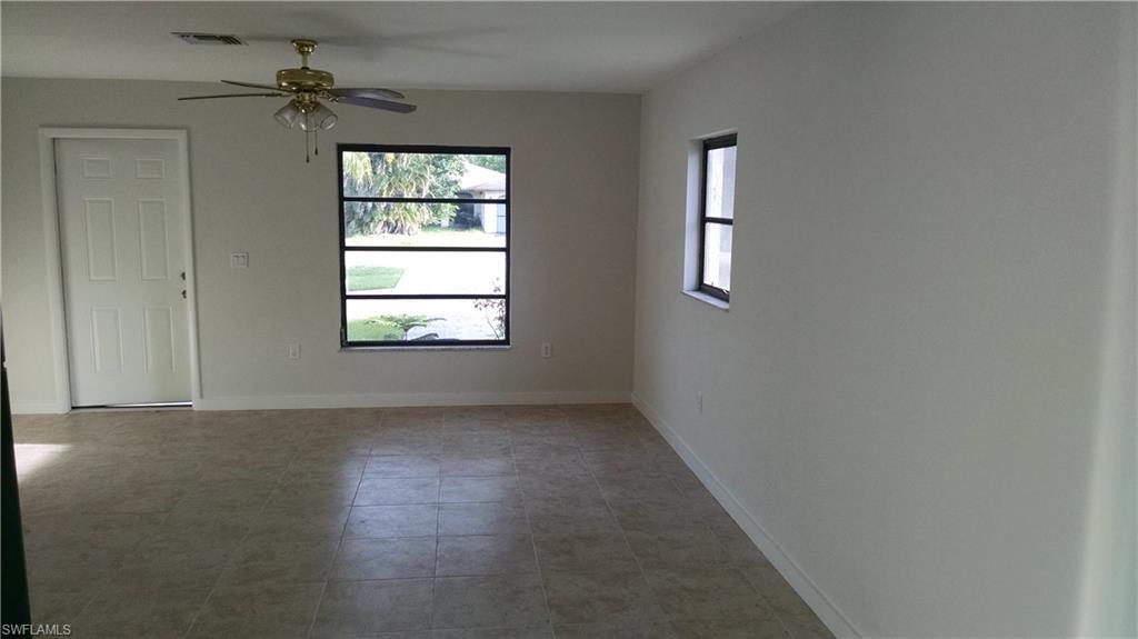 585 106th Avenue North Naples, FL 34108 - Photo 4 of 15 an empty room that has a window