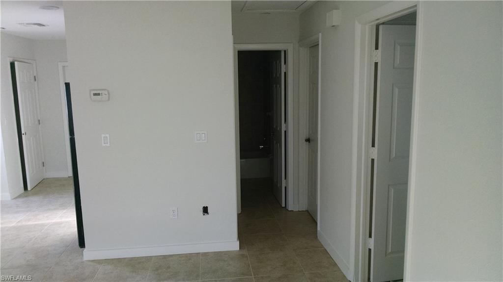 585 106th Avenue North Naples, FL 34108 - Photo 6 of 15 a view of a hallway with a hallway