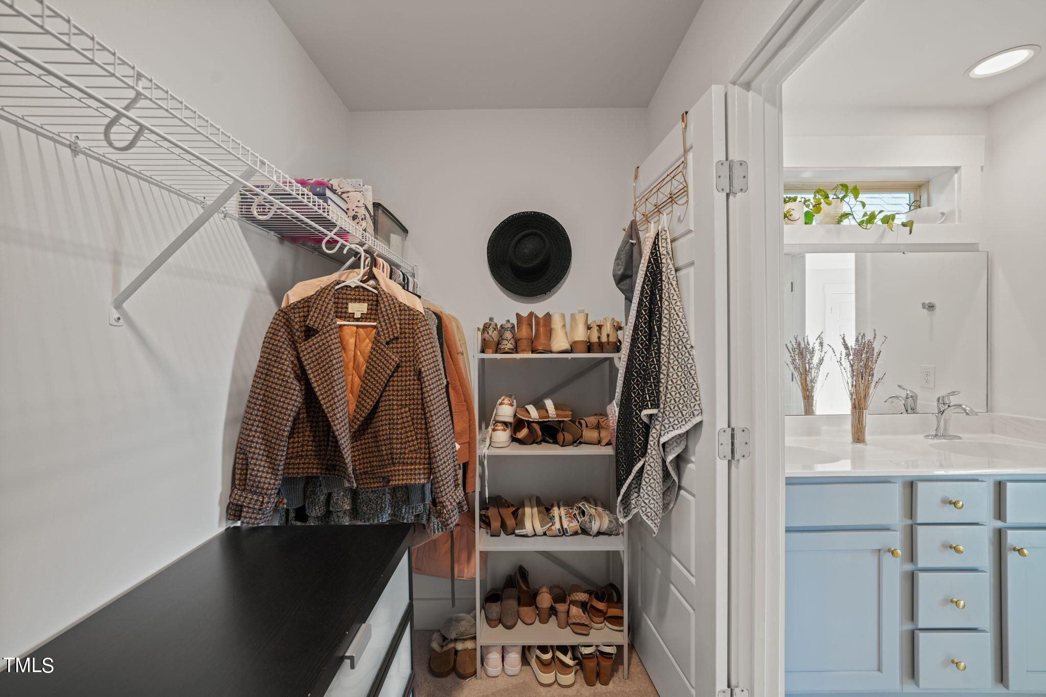 228 Daniel Ridge Road Wendell, NC 27591 - Photo 23 of 63 a view of walk in closet with clothes and shoes