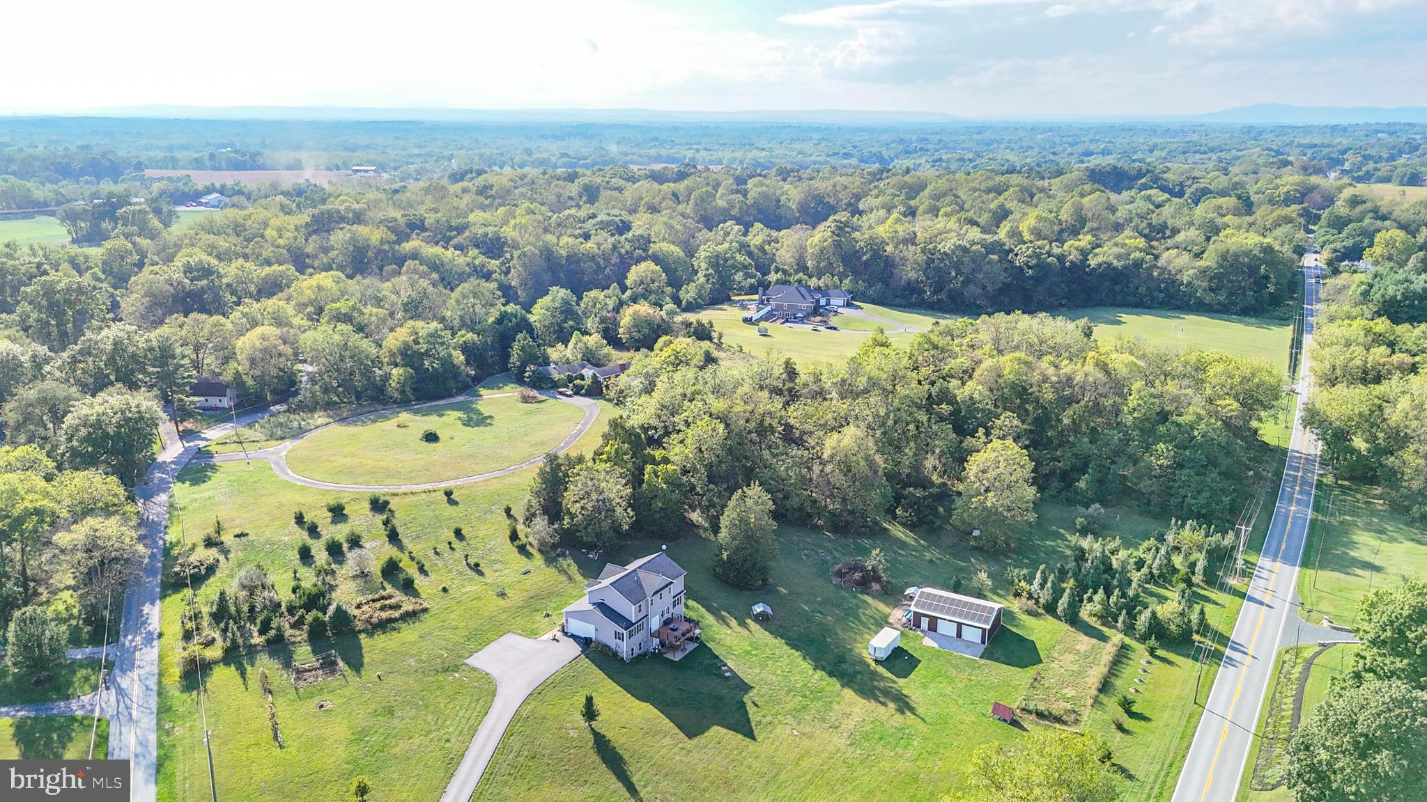 18614 Breathedsville Road Boonsboro, MD 21713 - Photo 8 of 13 an aerial view of residential house with outdoor space and swimming pool