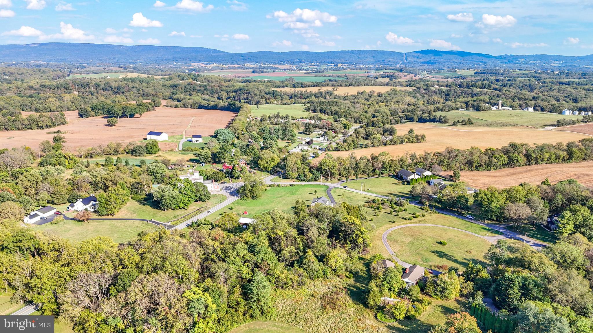 18614 Breathedsville Road Boonsboro, MD 21713 - Photo 10 of 13 an aerial view of lake and residential houses with outdoor space