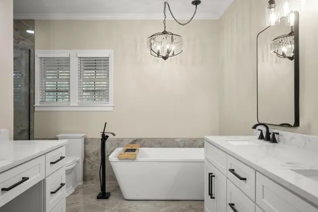 a view of a hallway with a ceiling fan