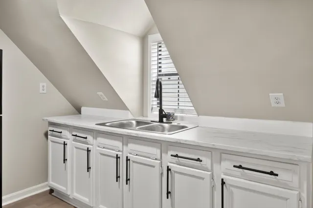 a view of a house with a yard and sitting area