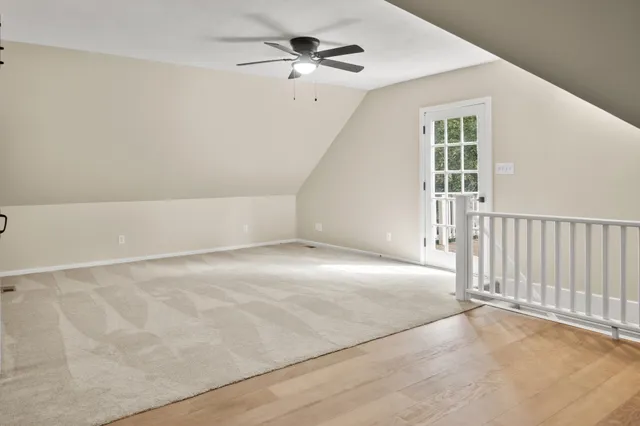 a view of a barn in the middle of a yard