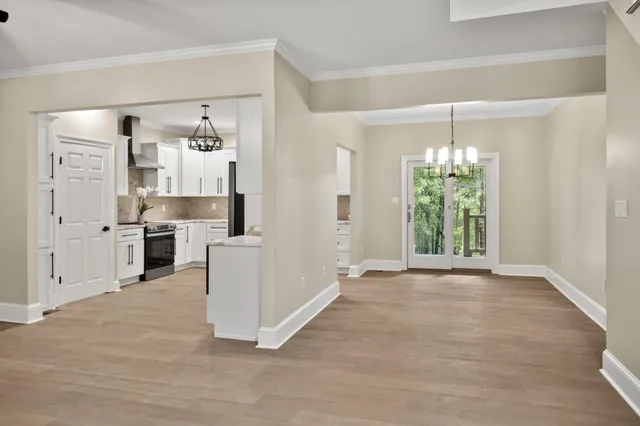 a kitchen with white cabinets and a sink