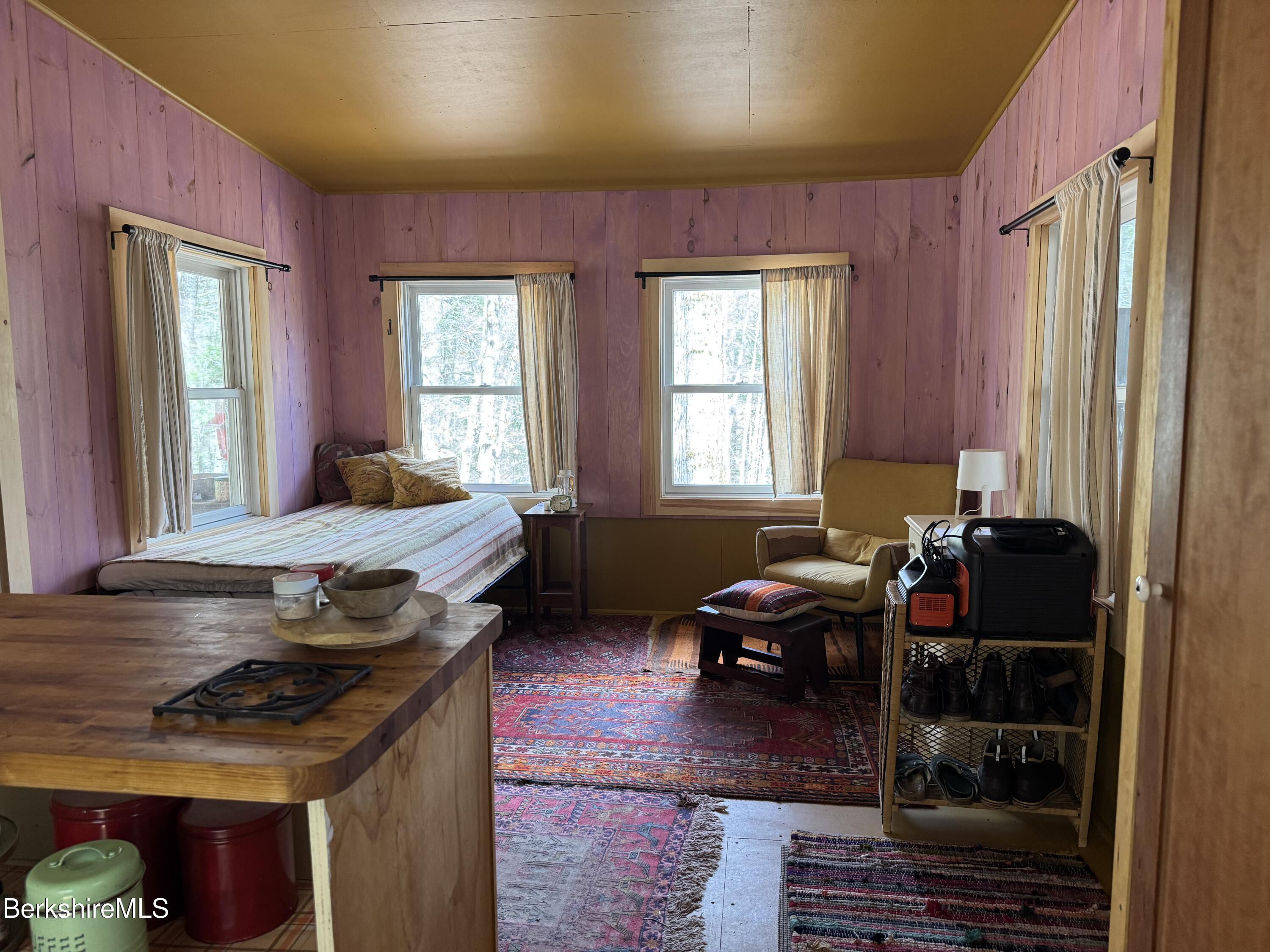 141 Stage Road Cummington, MA 01026 - Photo 12 of 25 a living room with furniture and a window
