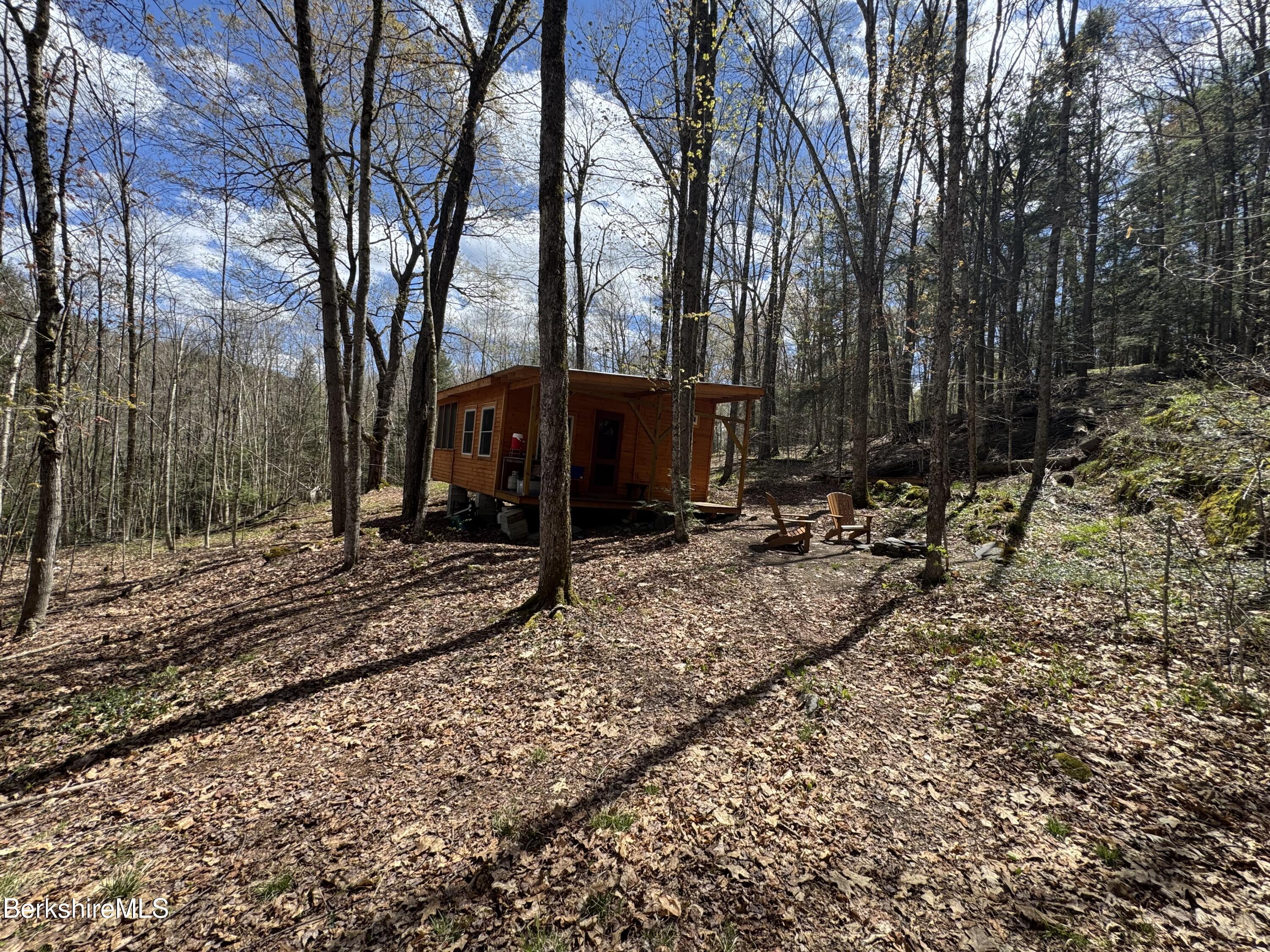 141 Stage Road Cummington, MA 01026 - Photo 9 of 25 a view of a backyard with a tree