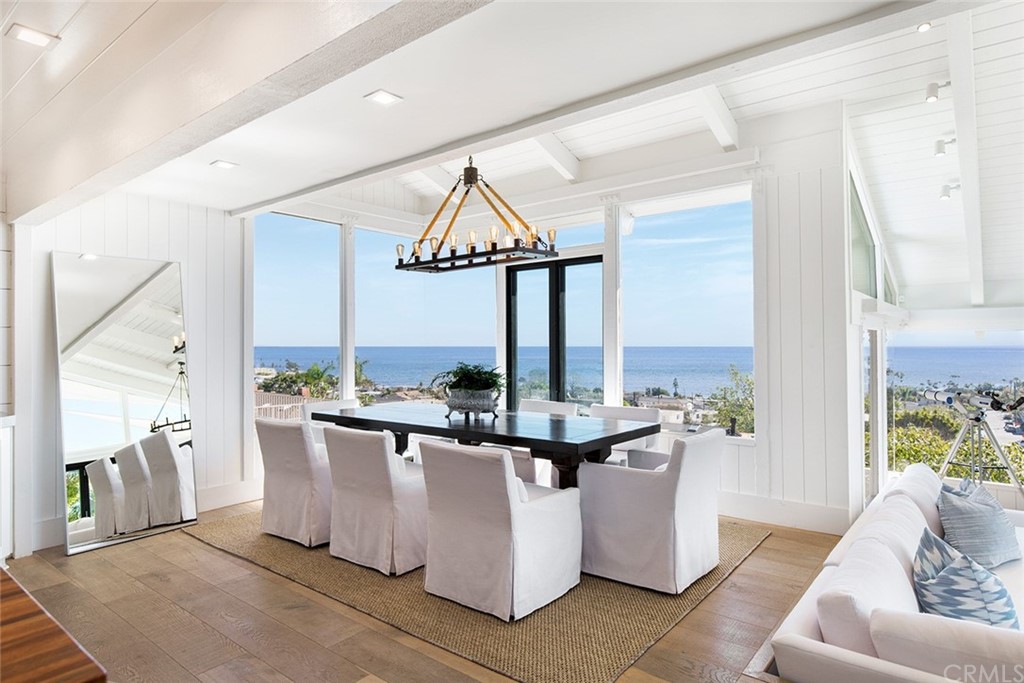 345 Heather Place Laguna Beach, CA 92651 - Photo 18 of 41 a living room with stainless steel appliances kitchen island granite countertop a table and chairs