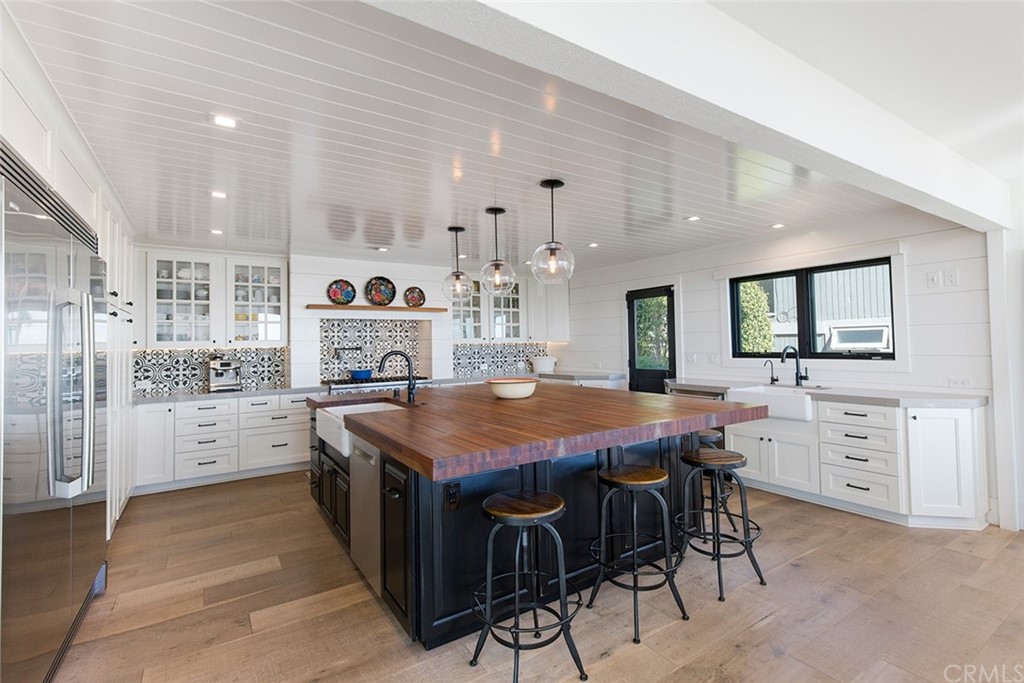 345 Heather Place Laguna Beach, CA 92651 - Photo 19 of 41 a kitchen that has a lot of counter space and appliances in it