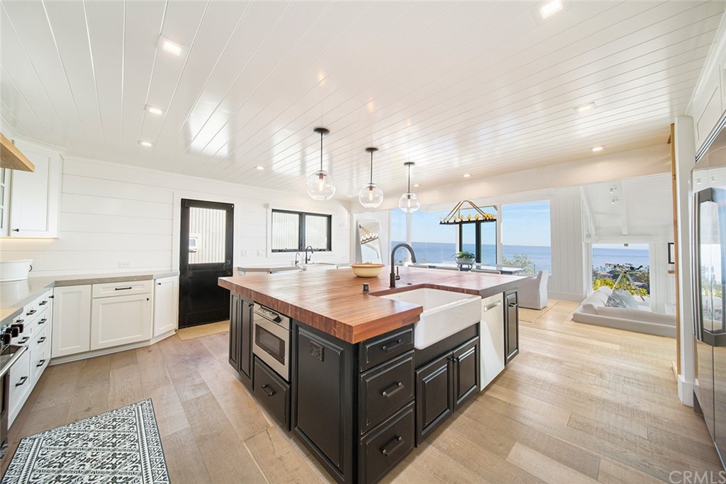 345 Heather Place Laguna Beach, CA 92651 - Photo 21 of 41 a kitchen with a stove and a sink