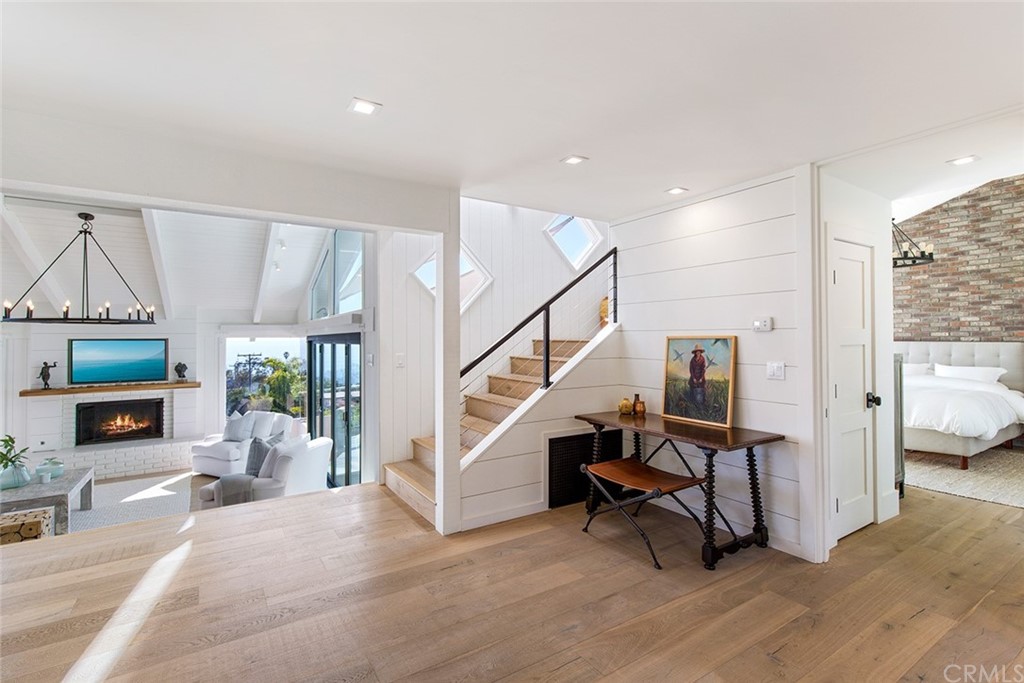 345 Heather Place Laguna Beach, CA 92651 - Photo 23 of 41 a view of hall way with furniture and fireplace