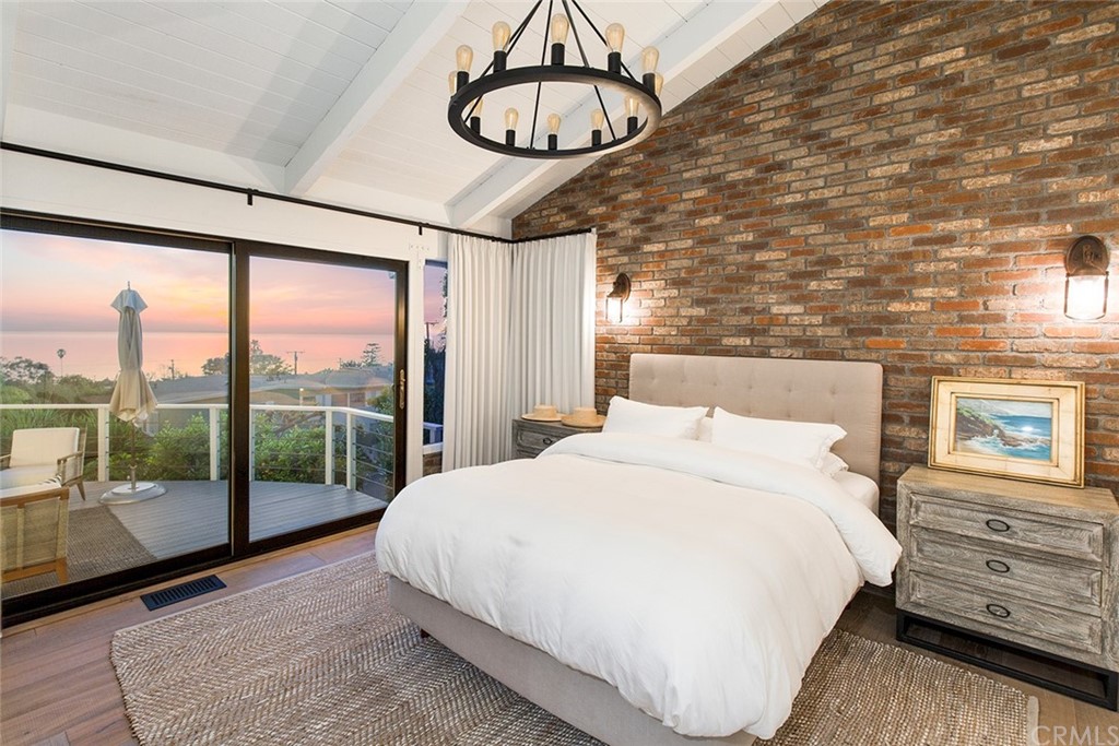 345 Heather Place Laguna Beach, CA 92651 - Photo 24 of 41 a bed sitting in a bedroom next to a window