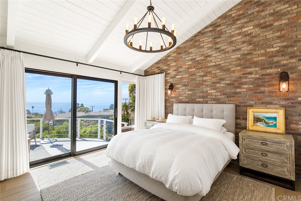 345 Heather Place Laguna Beach, CA 92651 - Photo 25 of 41 a bed sitting in a bedroom next to a window