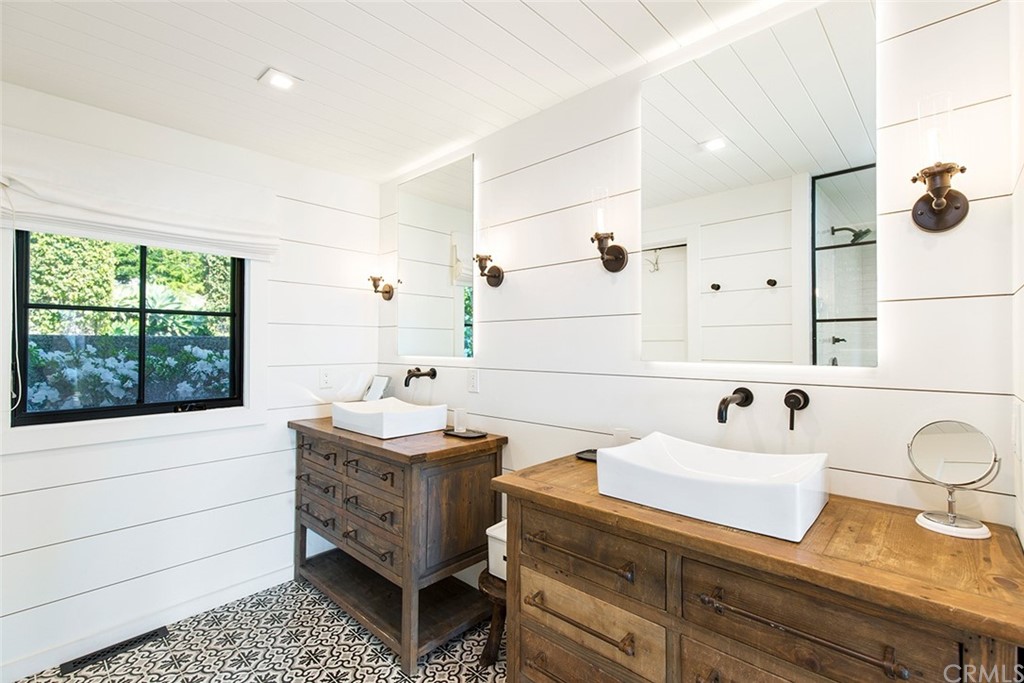 345 Heather Place Laguna Beach, CA 92651 - Photo 26 of 41 a bathroom with a sink and a window