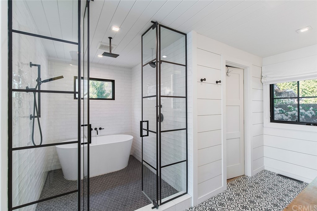 345 Heather Place Laguna Beach, CA 92651 - Photo 27 of 41 a bathroom with a shower and a glass door