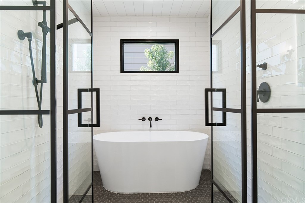 345 Heather Place Laguna Beach, CA 92651 - Photo 28 of 41 a white bath tub sitting next to a shower