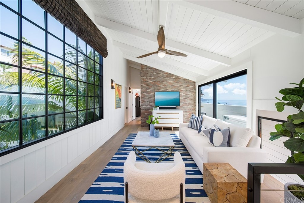 345 Heather Place Laguna Beach, CA 92651 - Photo 33 of 41 a living room with furniture and a large window