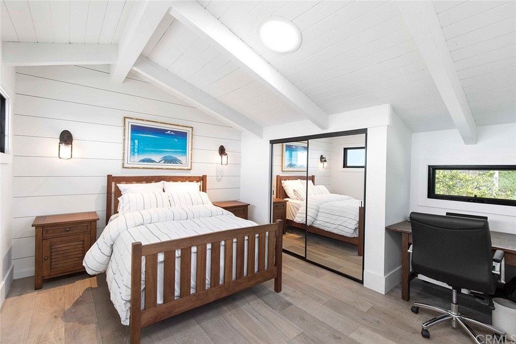 345 Heather Place Laguna Beach, CA 92651 - Photo 36 of 41 a bedroom with furniture and a flat screen tv