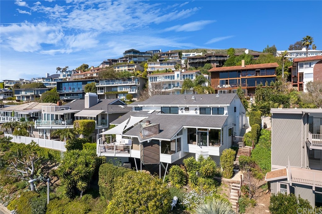 345 Heather Place Laguna Beach, CA 92651 - Photo 39 of 41 a front view of a building with a lot of plants and trees