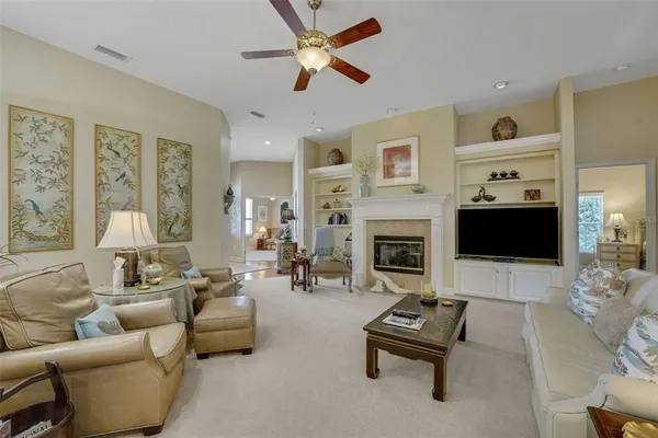 a living room with furniture and a fireplace