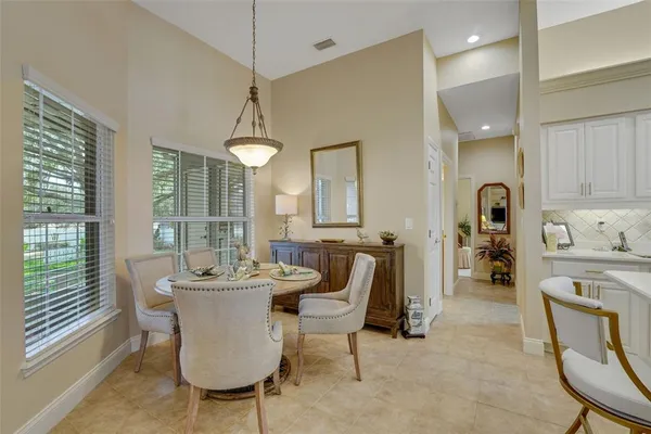 a dining room with furniture and window