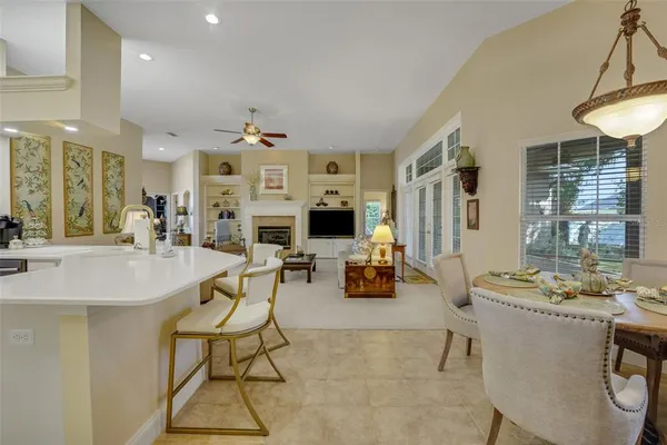 a living room with fireplace furniture and a wooden floor