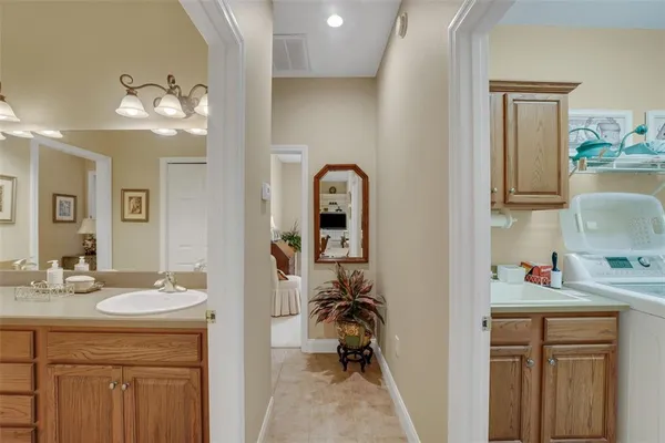 a en suite bathroom with a sink double vanity and a mirror