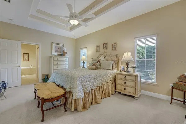 a bedroom with a bed and a table in it