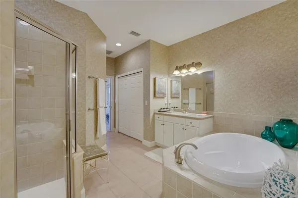 a bathroom with a granite countertop sink a toilet and shower