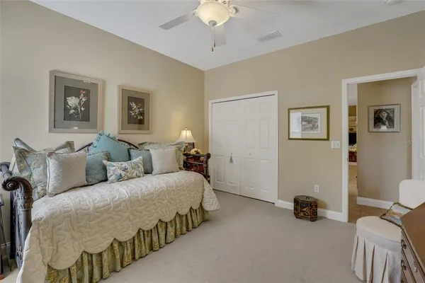 a bed room with two bed and a chandelier