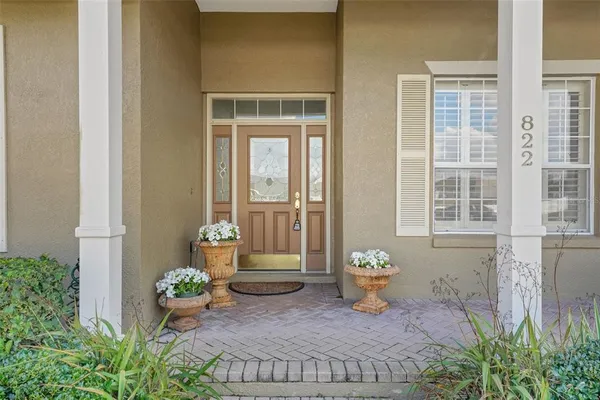 a front view of a house with outdoor seating