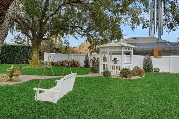 a view of a house with a yard porch and sitting area