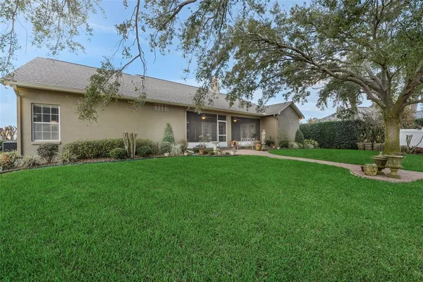 a view of a house with a yard porch and sitting area