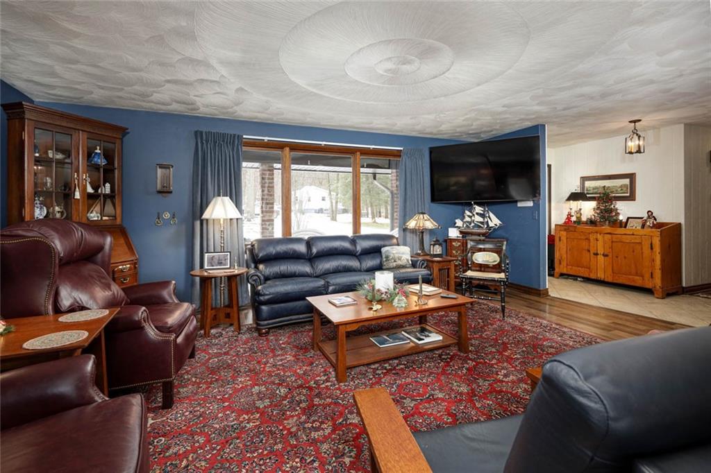 850 Martin Indiana, PA 15701 - Photo 9 of 49 a living room with furniture a flat screen tv and a fireplace