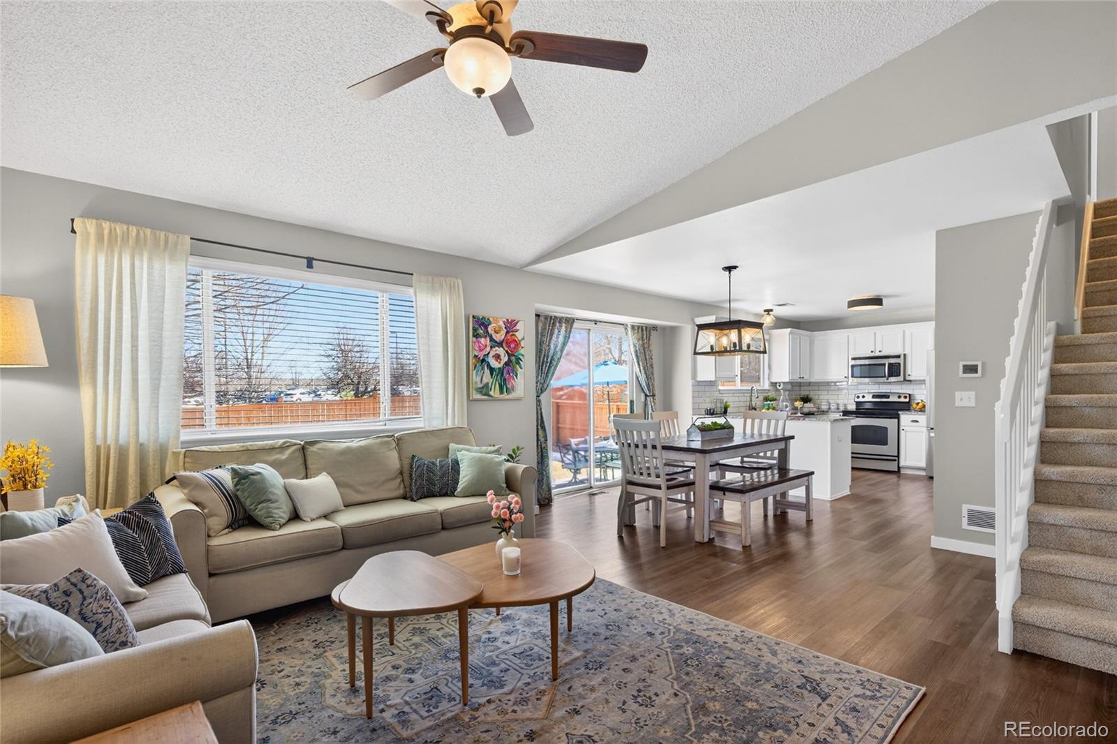 9600 South Castle Ridge Circle Highlands Ranch, CO 80129 - Photo 2 of 50 a living room with furniture and a large window