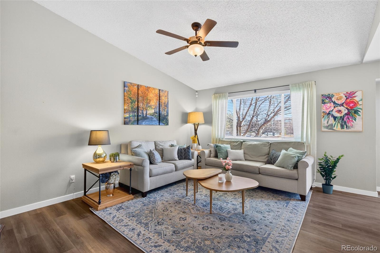 9600 South Castle Ridge Circle Highlands Ranch, CO 80129 - Photo 4 of 50 a living room with furniture and a window