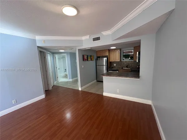 a kitchen with stainless steel appliances granite countertop a refrigerator a stove a sink and dishwasher