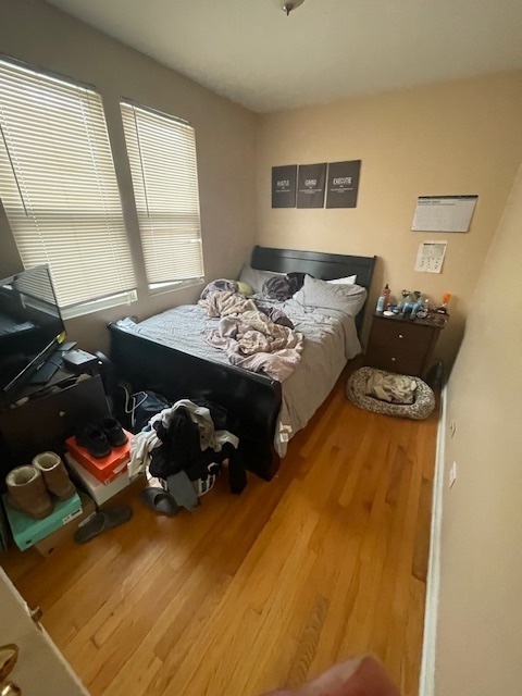 2620 West 24th Street Chicago, IL 60608 - Photo 11 of 25 a bedroom with a bed and a dresser