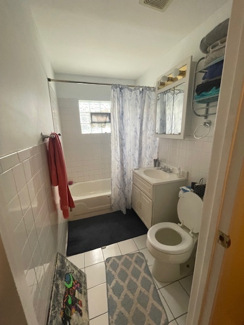 2620 West 24th Street Chicago, IL 60608 - Photo 14 of 25 a bathroom with a toilet and a shower