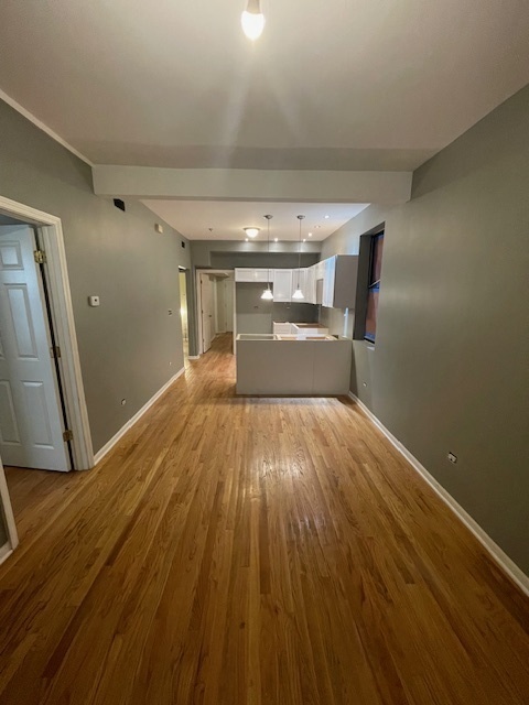 2620 West 24th Street Chicago, IL 60608 - Photo 16 of 25 a view of empty room with wooden floor