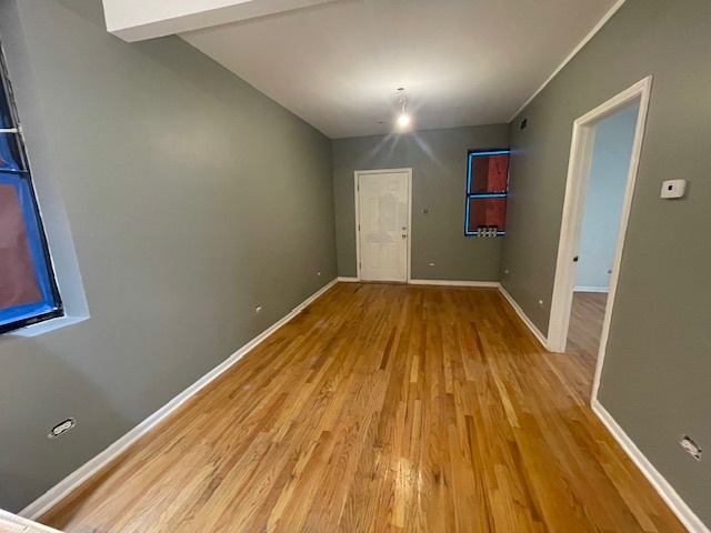 2620 West 24th Street Chicago, IL 60608 - Photo 19 of 25 a view of a big room with wooden floor and staircase